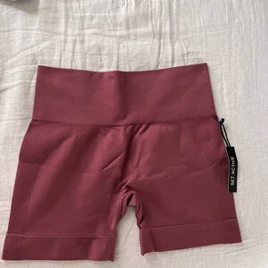 set active biker shorts. never worn, tags still on. pink size large